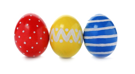 Photo of Decorated Easter eggs on white background. Festive tradition