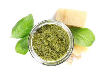 Photo of Fresh tasty pesto sauce, basil and cheese isolated on white, top view