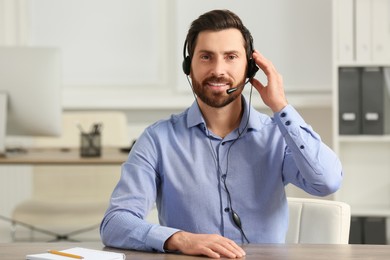 Hotline operator with headset working in office, space for text