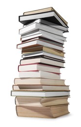 Photo of High stack of many different books isolated on white