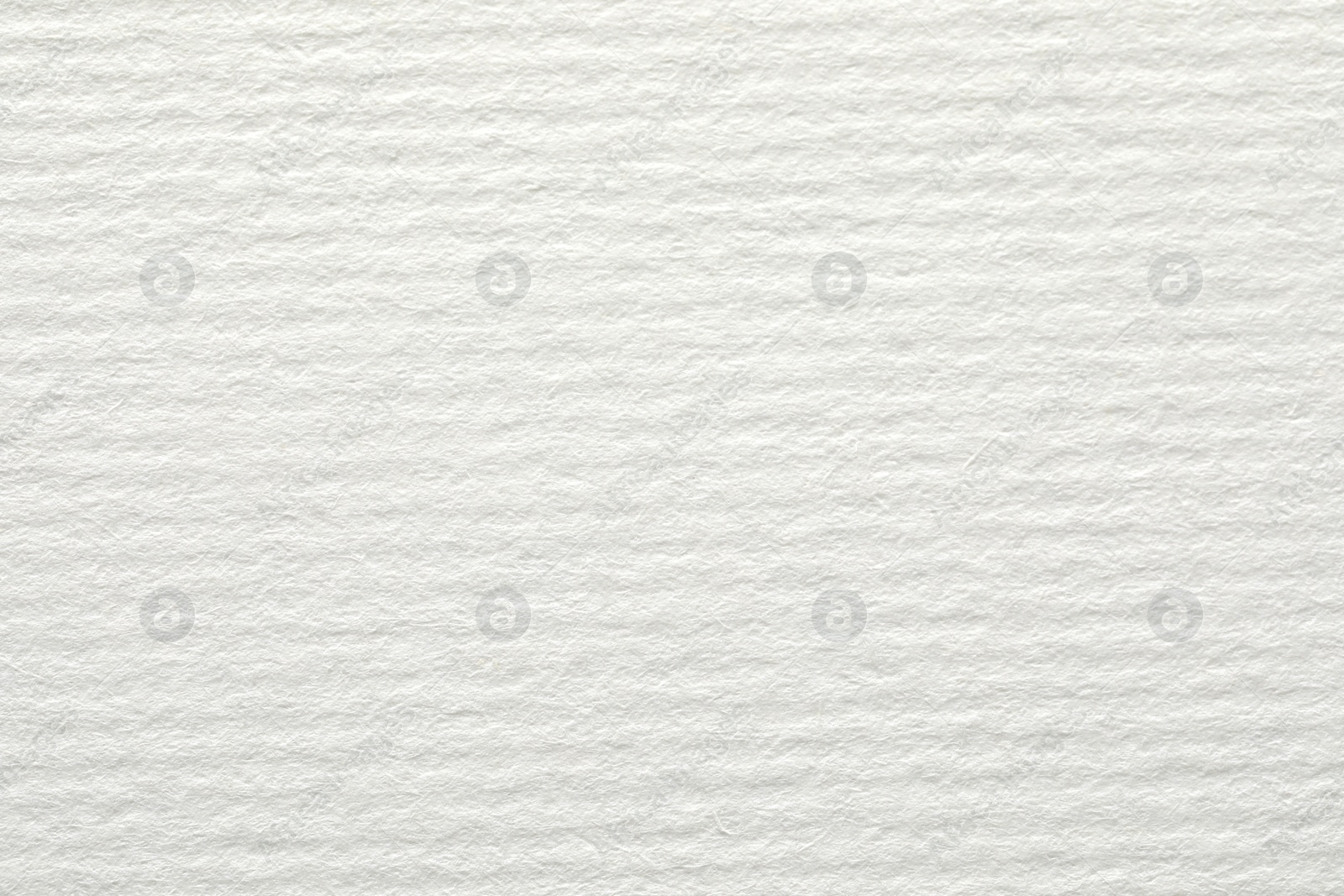 Photo of Texture of white paper sheet as background, closeup