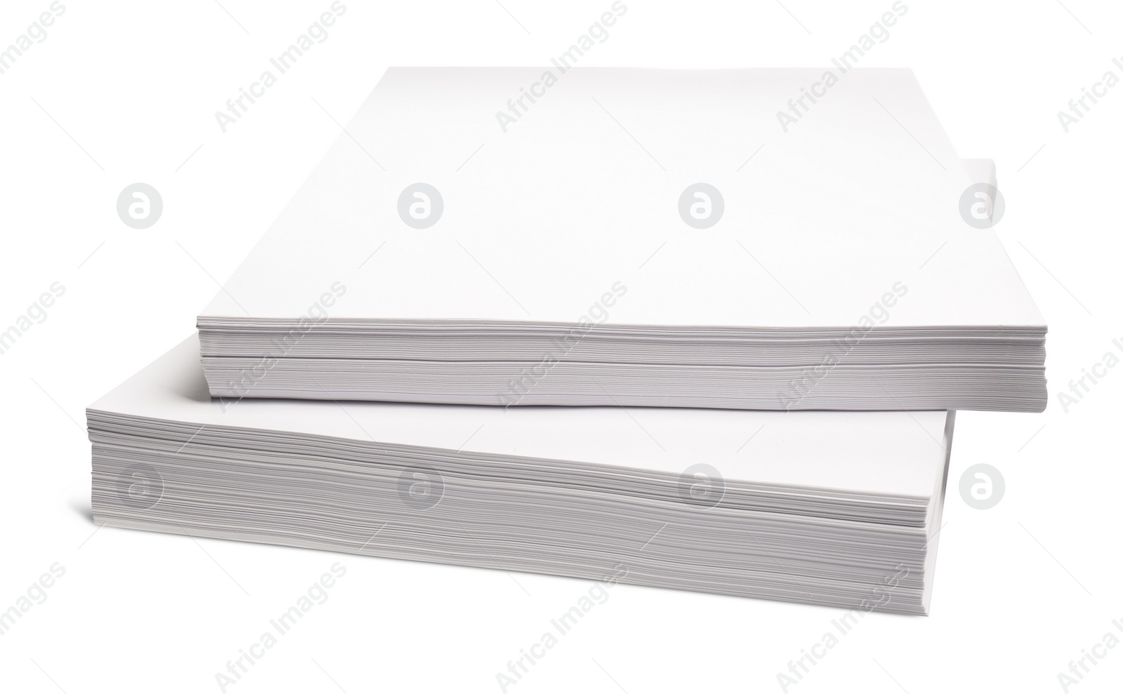 Photo of Stacks of paper sheets on white background