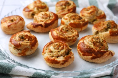 Photo of Fresh delicious puff pastry with tasty filling on tray, closeup