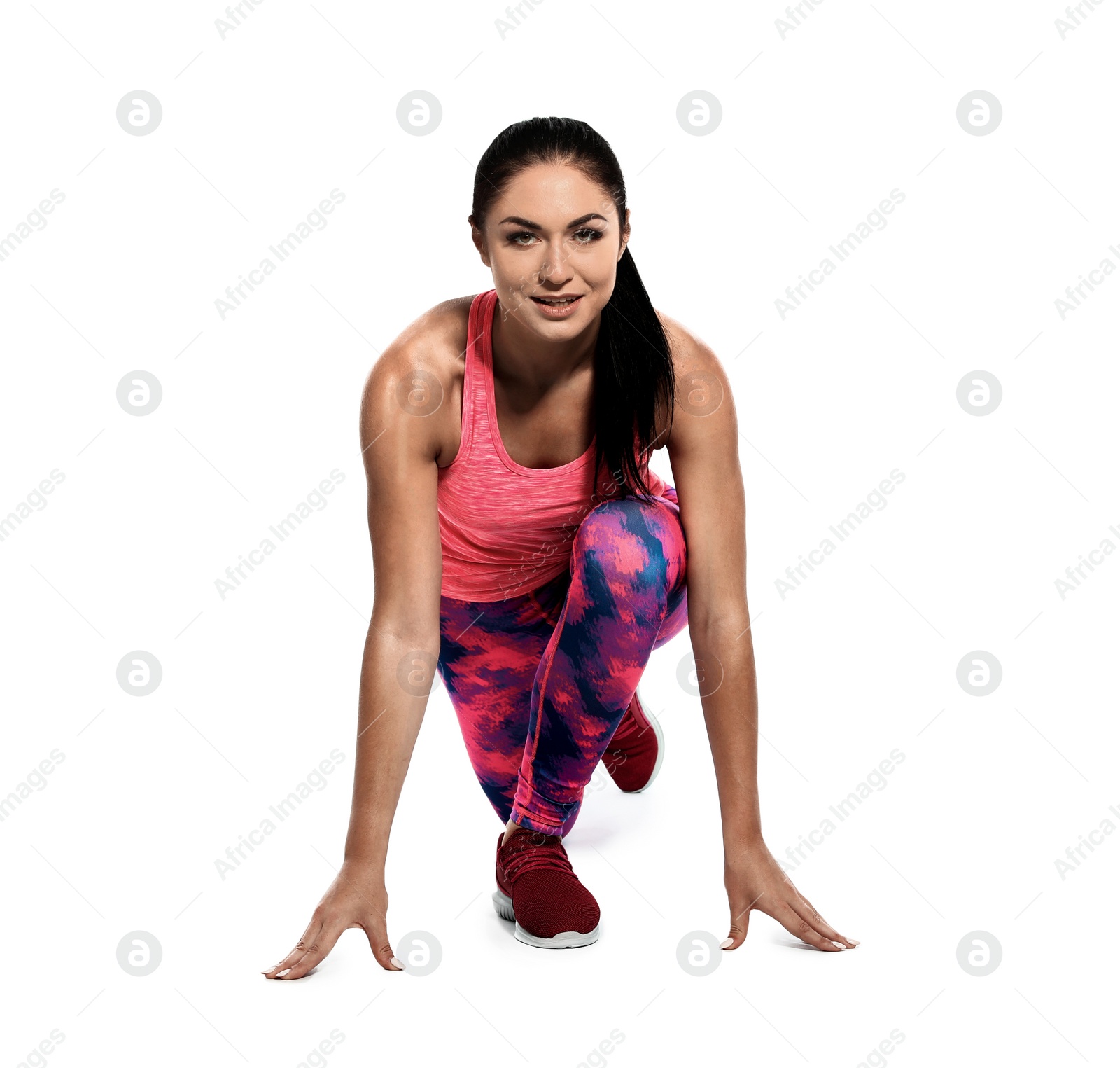 Photo of Young woman ready to run on white background