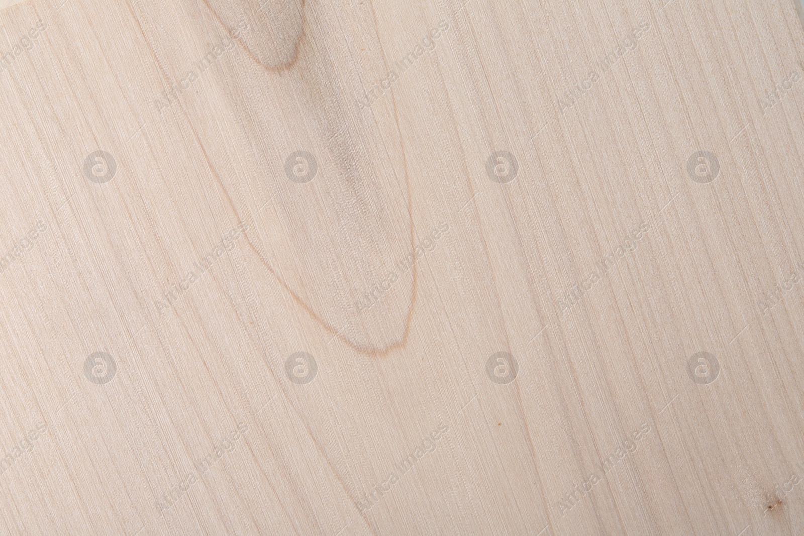 Photo of Texture of wooden cutting board as background, top view