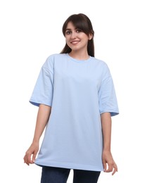 Smiling woman in stylish light blue t-shirt on white background