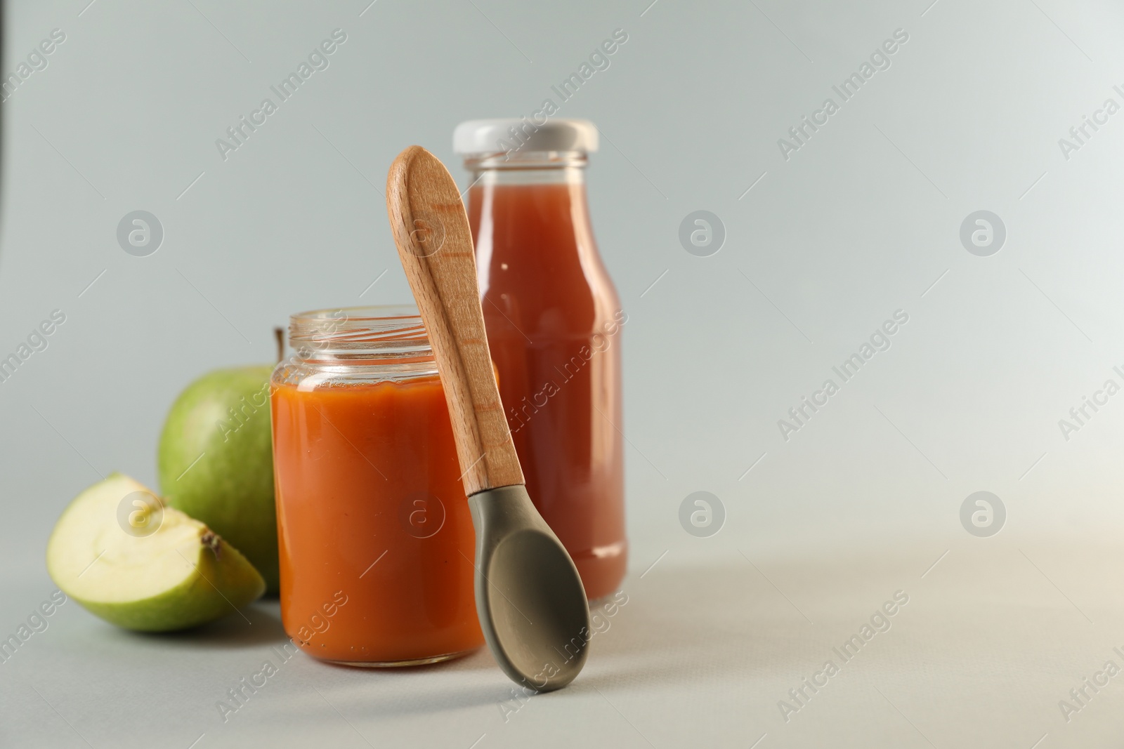 Photo of Healthy baby food, apple and juice on white background, space for text