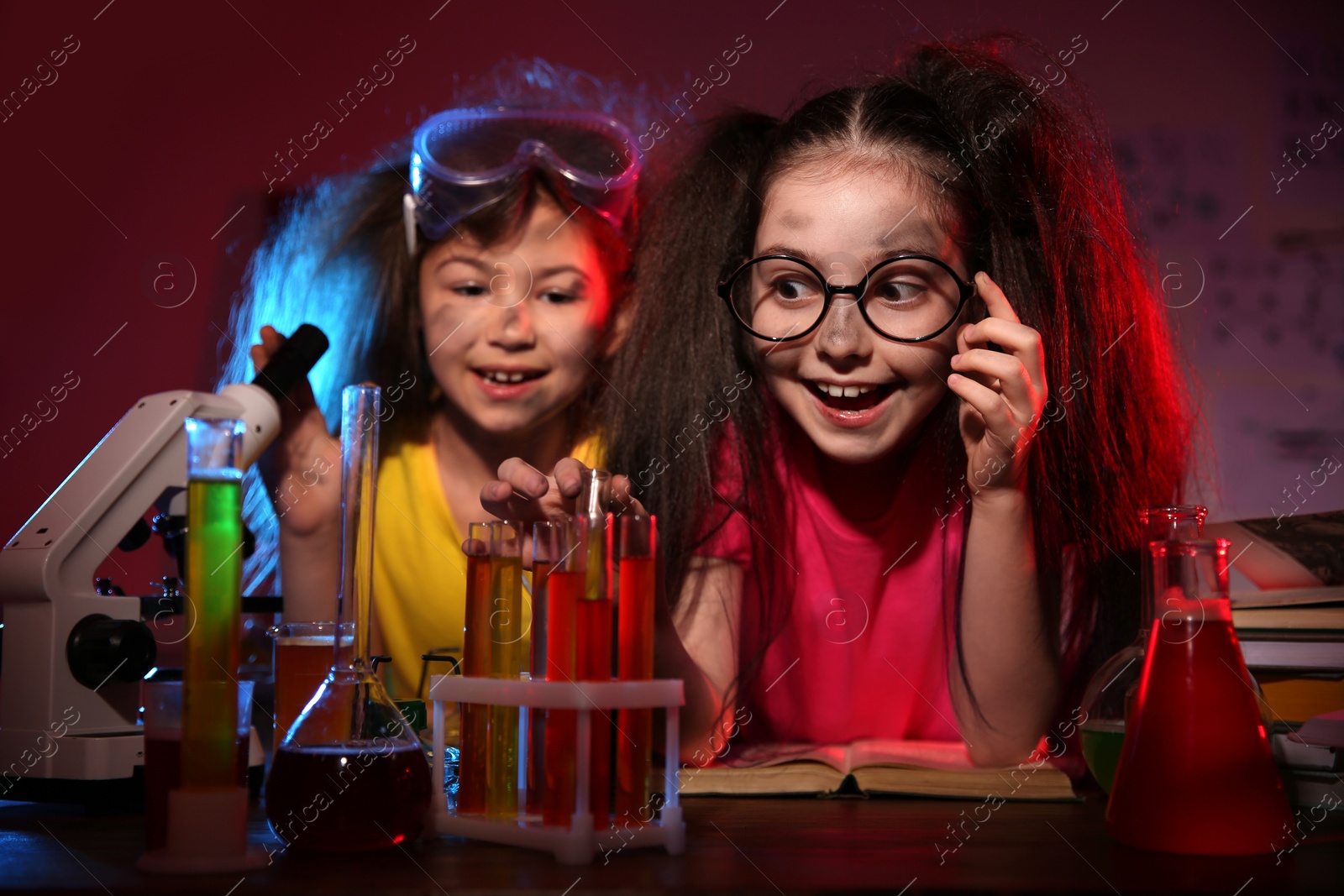 Photo of Children doing chemical research in laboratory. Dangerous experiment