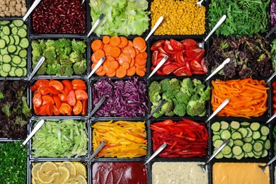 Photo of Salad bar with different fresh ingredients as background, top view