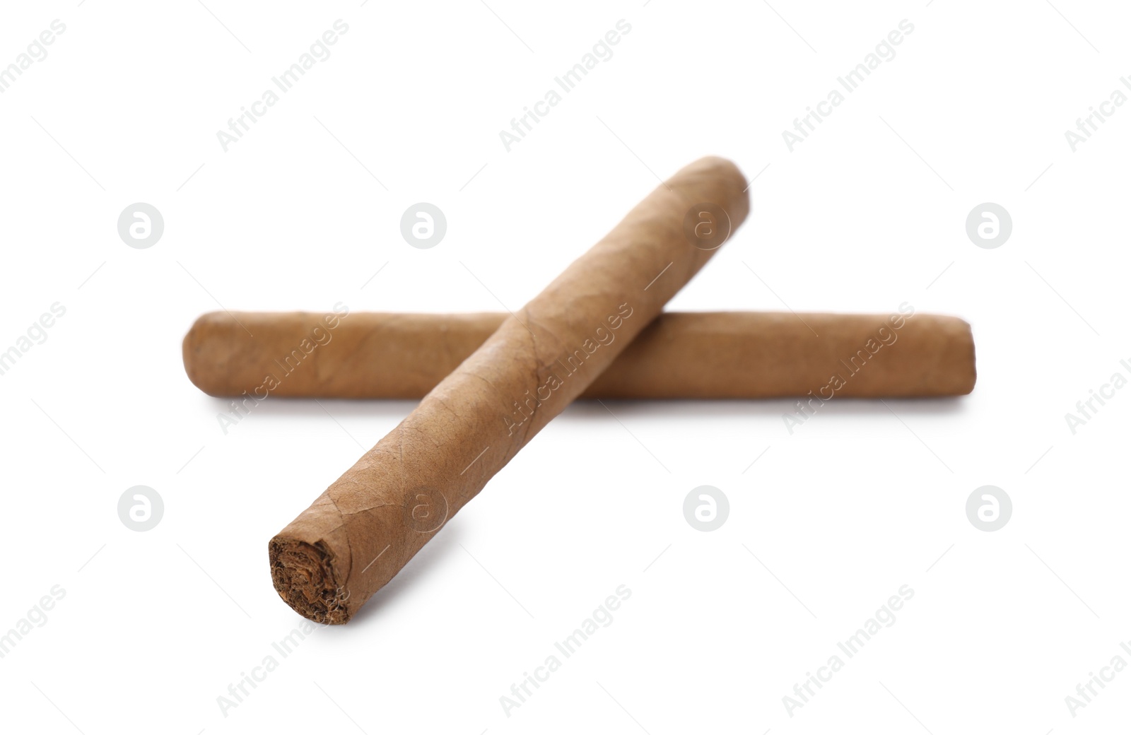 Photo of Cigars wrapped in tobacco leaves on white background