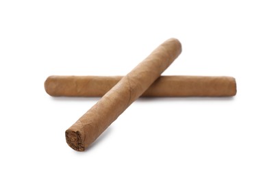 Photo of Cigars wrapped in tobacco leaves on white background