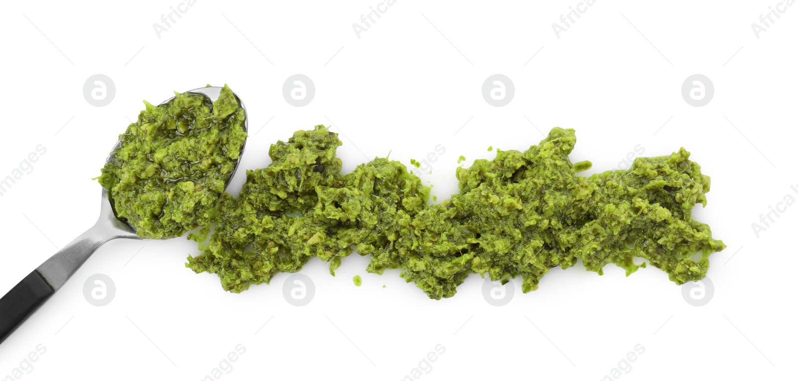 Photo of Spoon with delicious pesto sauce isolated on white, top view