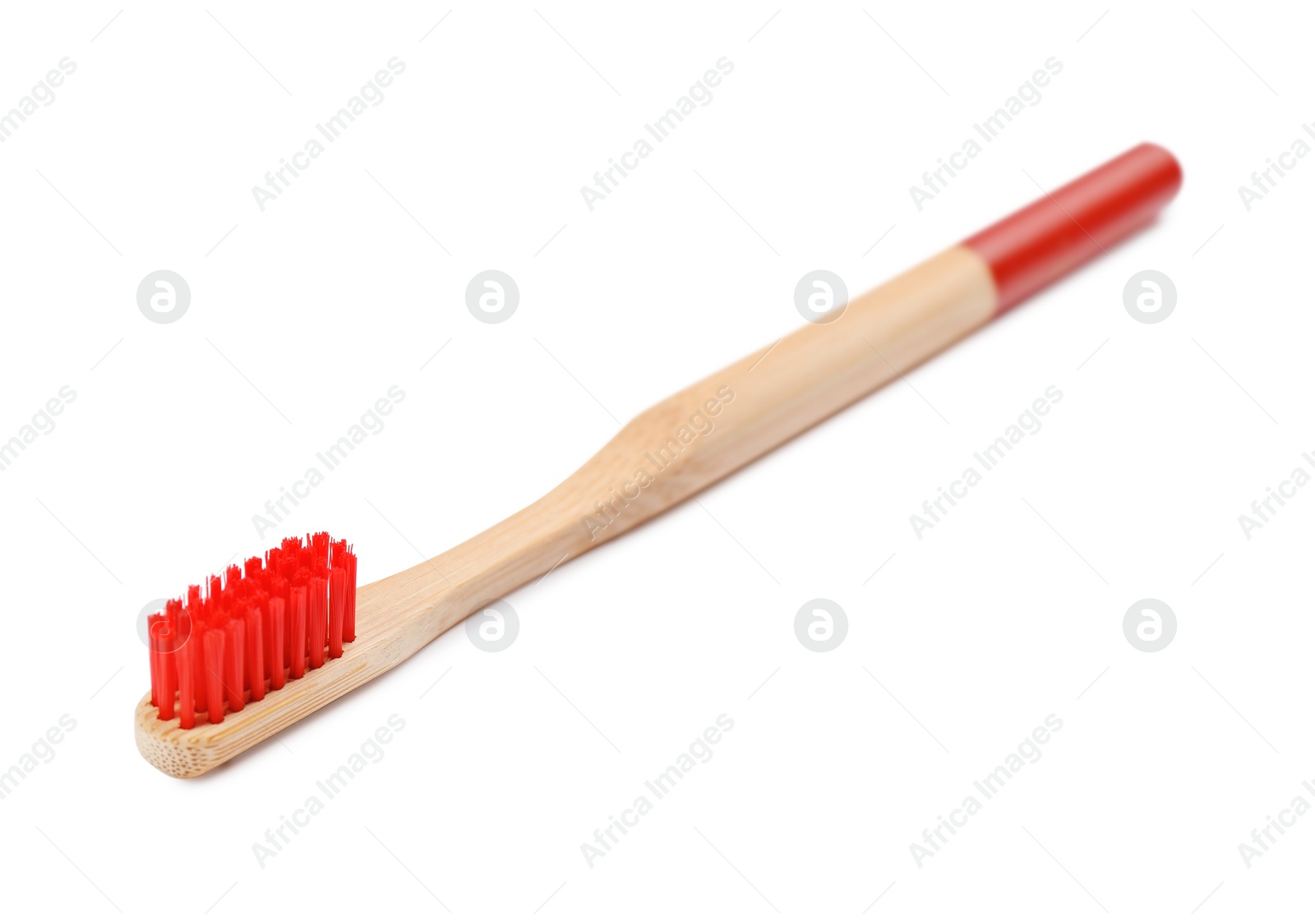 Photo of Bamboo toothbrush with red bristle isolated on white