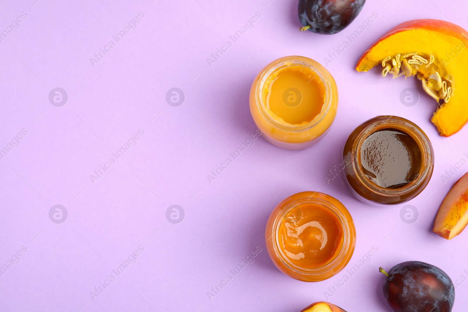 Photo of Flat lay composition with healthy baby food and ingredients on violet background. Space for text