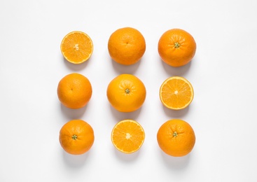 Photo of Composition with ripe oranges on white background, top view