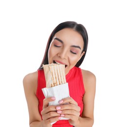 Photo of Young woman eating delicious shawarma on white background