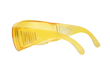 Photo of Protective goggles on white background. Construction tool