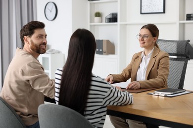 Couple having meeting with lawyer in office