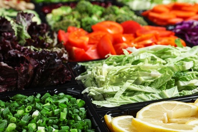 Photo of Salad bar with different fresh ingredients as background, closeup