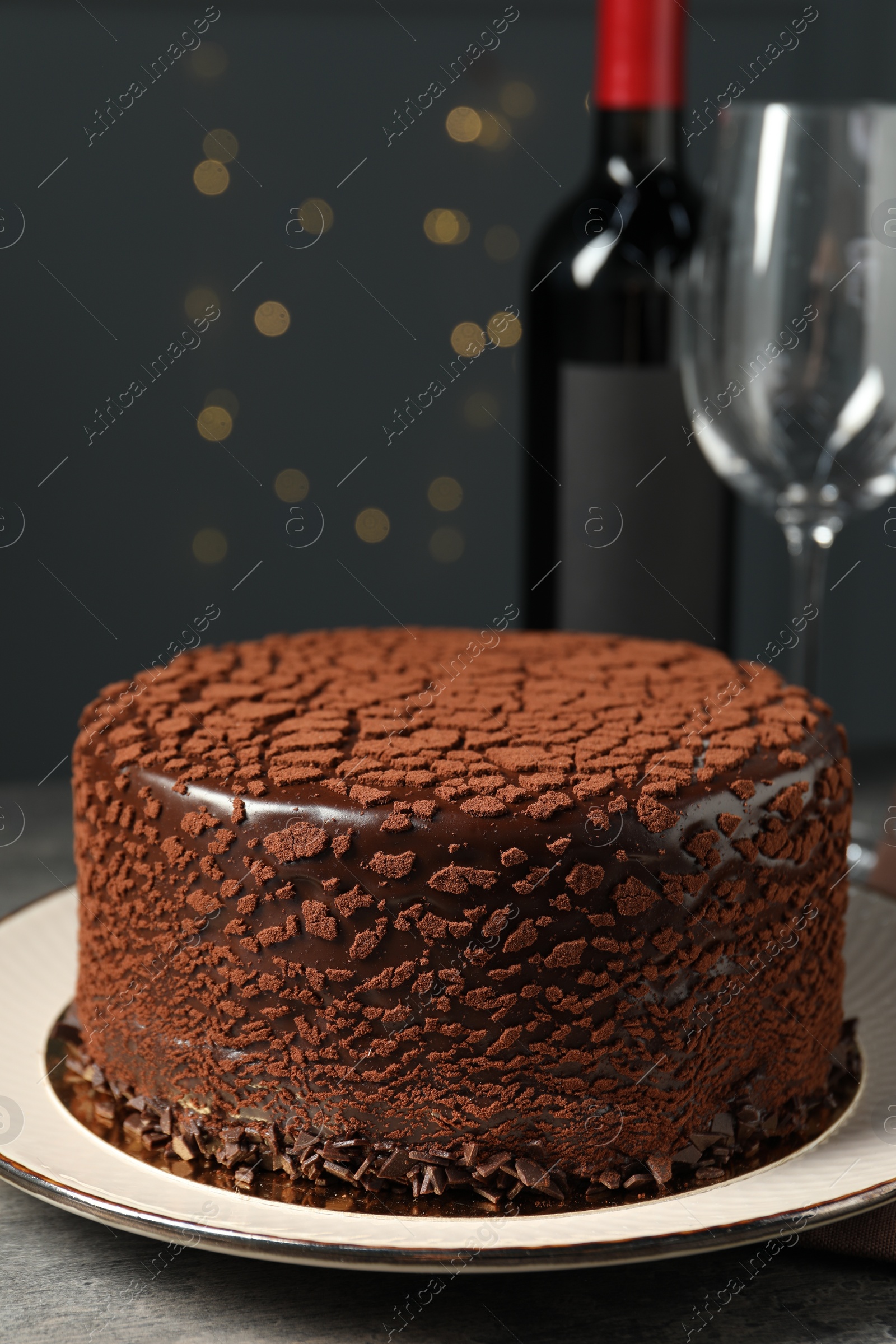 Photo of Delicious chocolate truffle cake on grey table