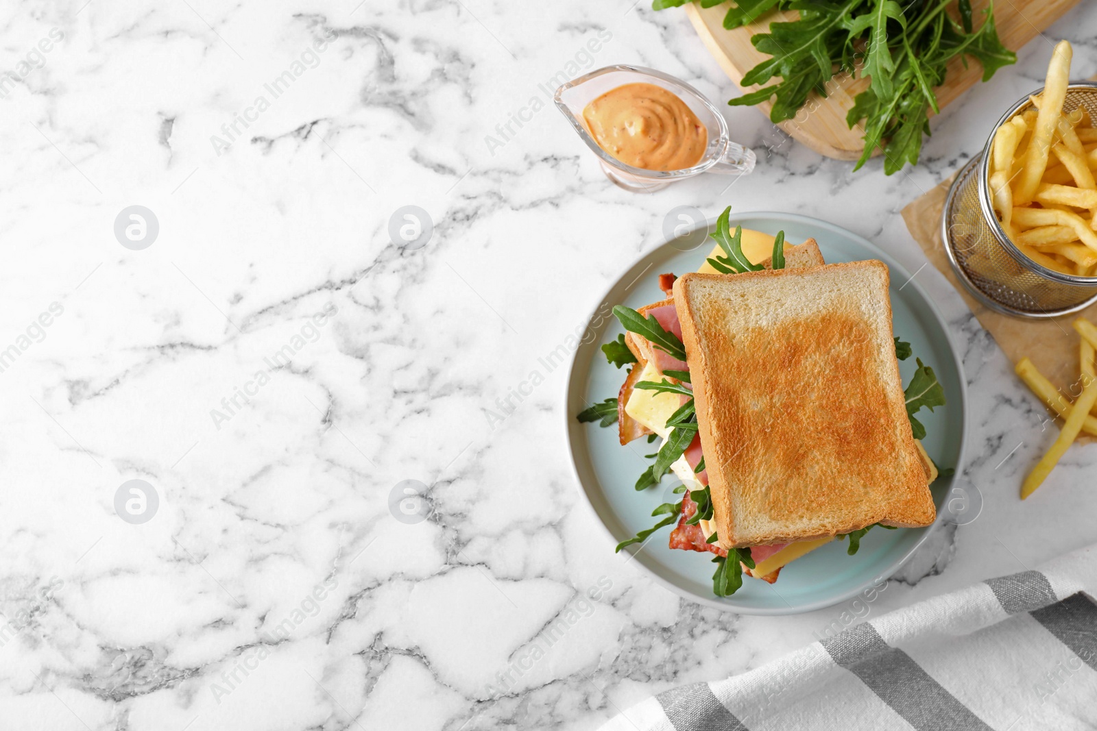Photo of Tasty sandwich with toasted bread served on white marble table, top view. Space for text
