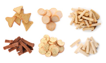 Image of Set with different delicious crispy rusks on white background, top view