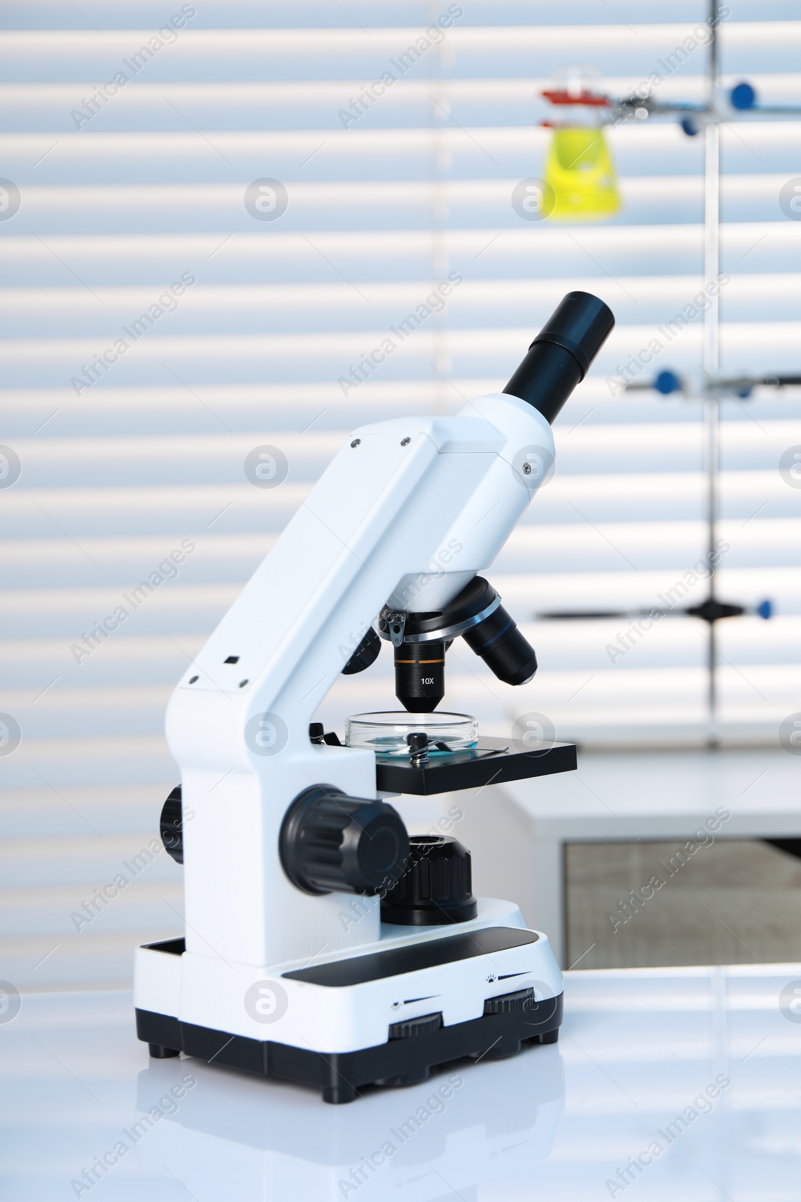 Photo of Laboratory analysis. Modern medical microscope on white table indoors