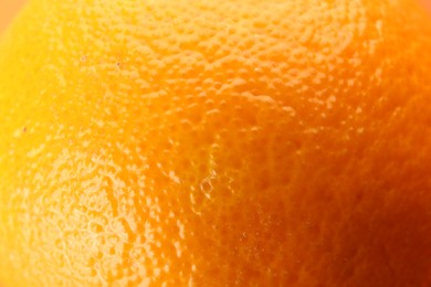 Photo of Delicious unpeeled orange fruit as background, closeup