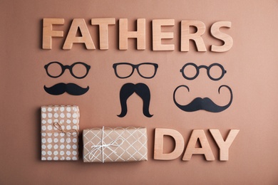 Photo of Flat lay composition with paper decor and gift boxes on color background. Happy Father's Day