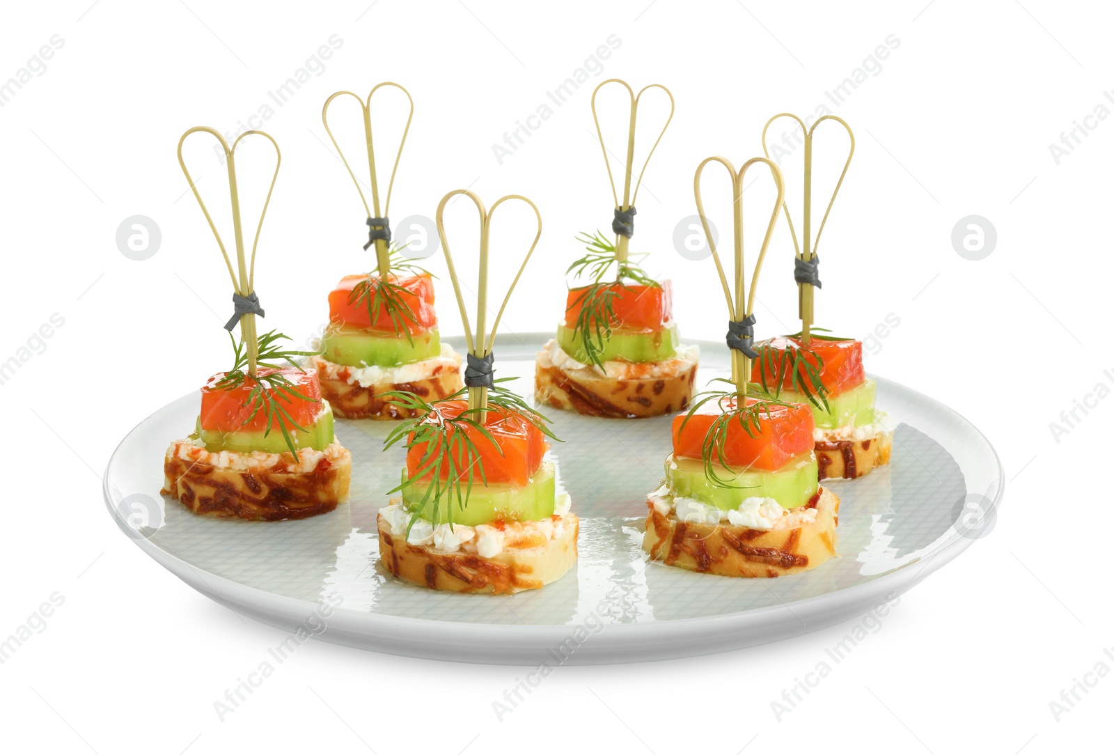 Photo of Tasty canapes with salmon, cucumber, bread and cream cheese isolated on white