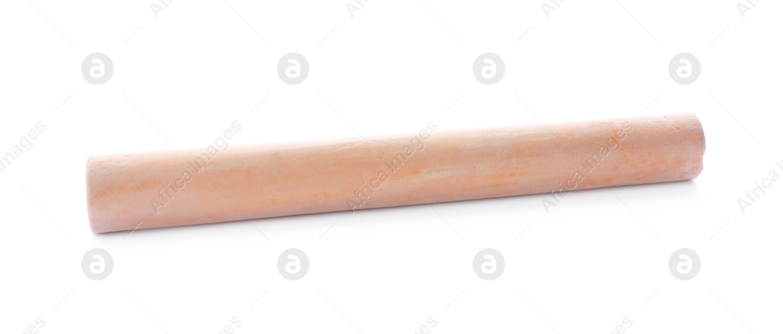 Photo of Piece of orange chalk isolated on white