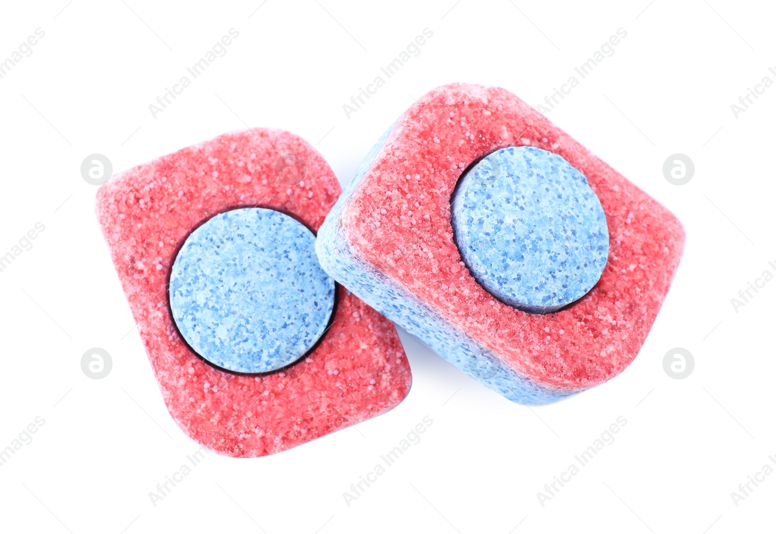 Photo of Two dishwasher detergent tablets on white background, top view