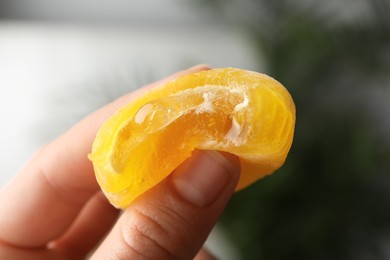 Photo of Woman holding delicious mochi, closeup. Japanese cuisine