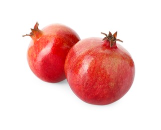 Photo of Two fresh ripe pomegranates isolated on white