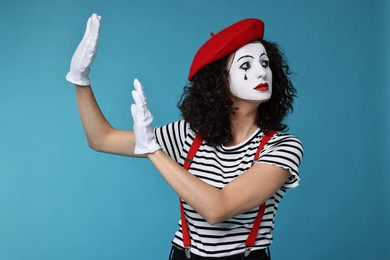 Photo of Sad mine with beret posing on light blue background