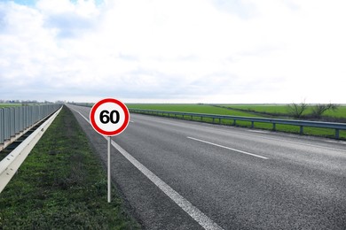 Image of Traffic sign MAXIMUM SPEED 60 near empty asphalt road