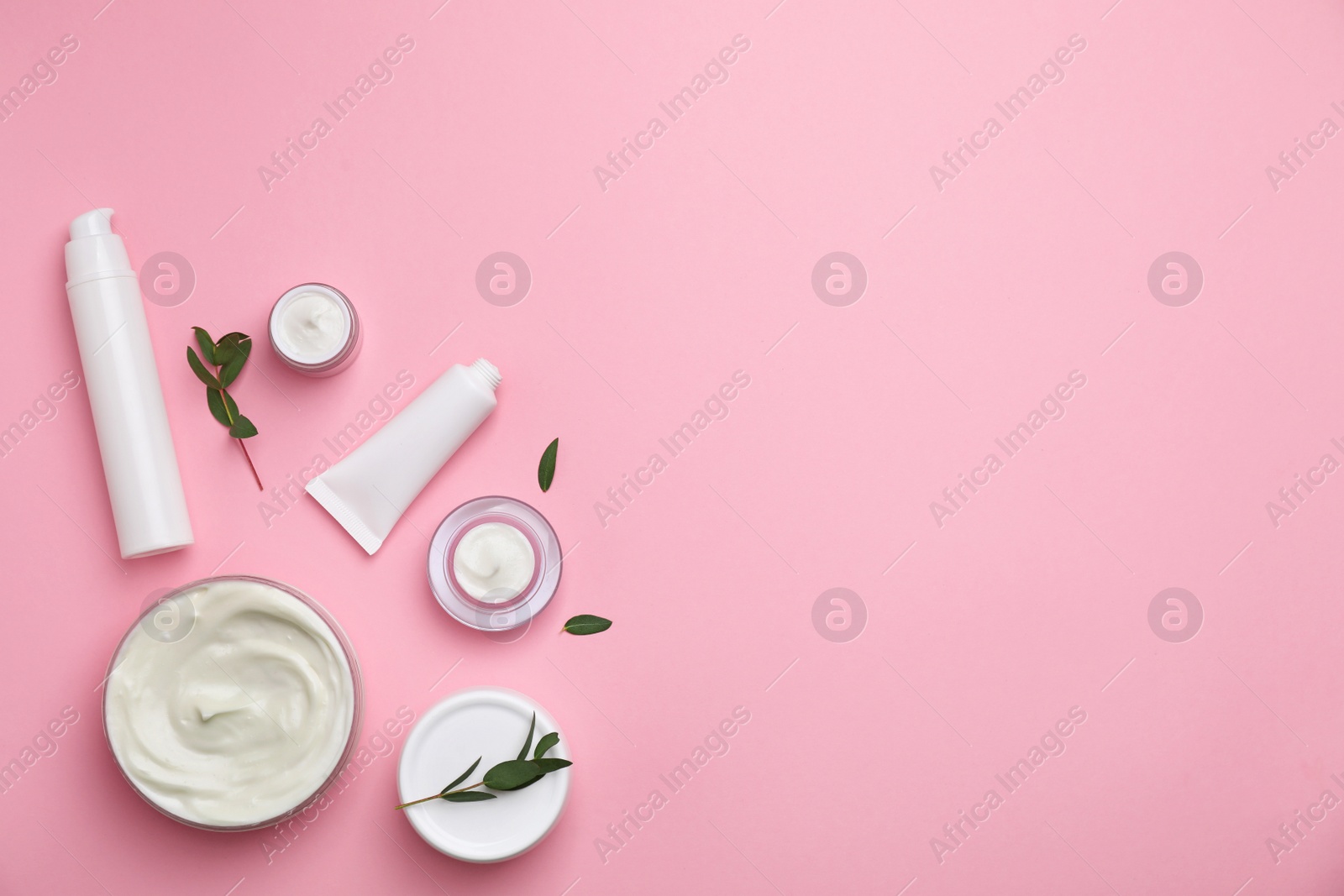 Photo of Flat lay composition with cosmetic products on color background