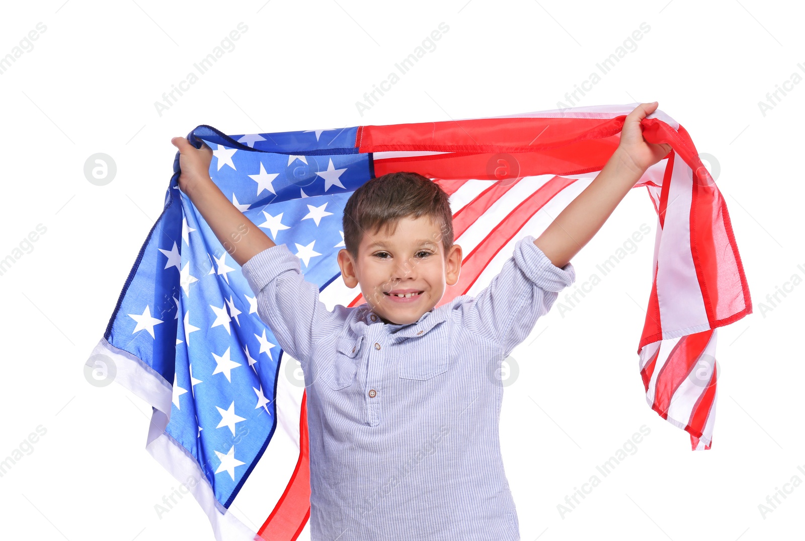 Photo of Portrait of cute little boy with American flag on white background