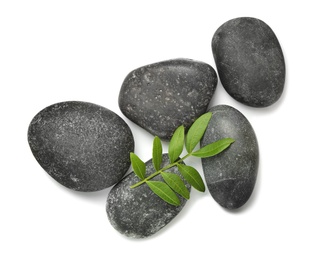 Composition with spa stones on white background, top view