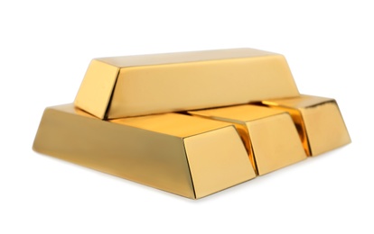 Photo of Precious shiny gold bars on white background