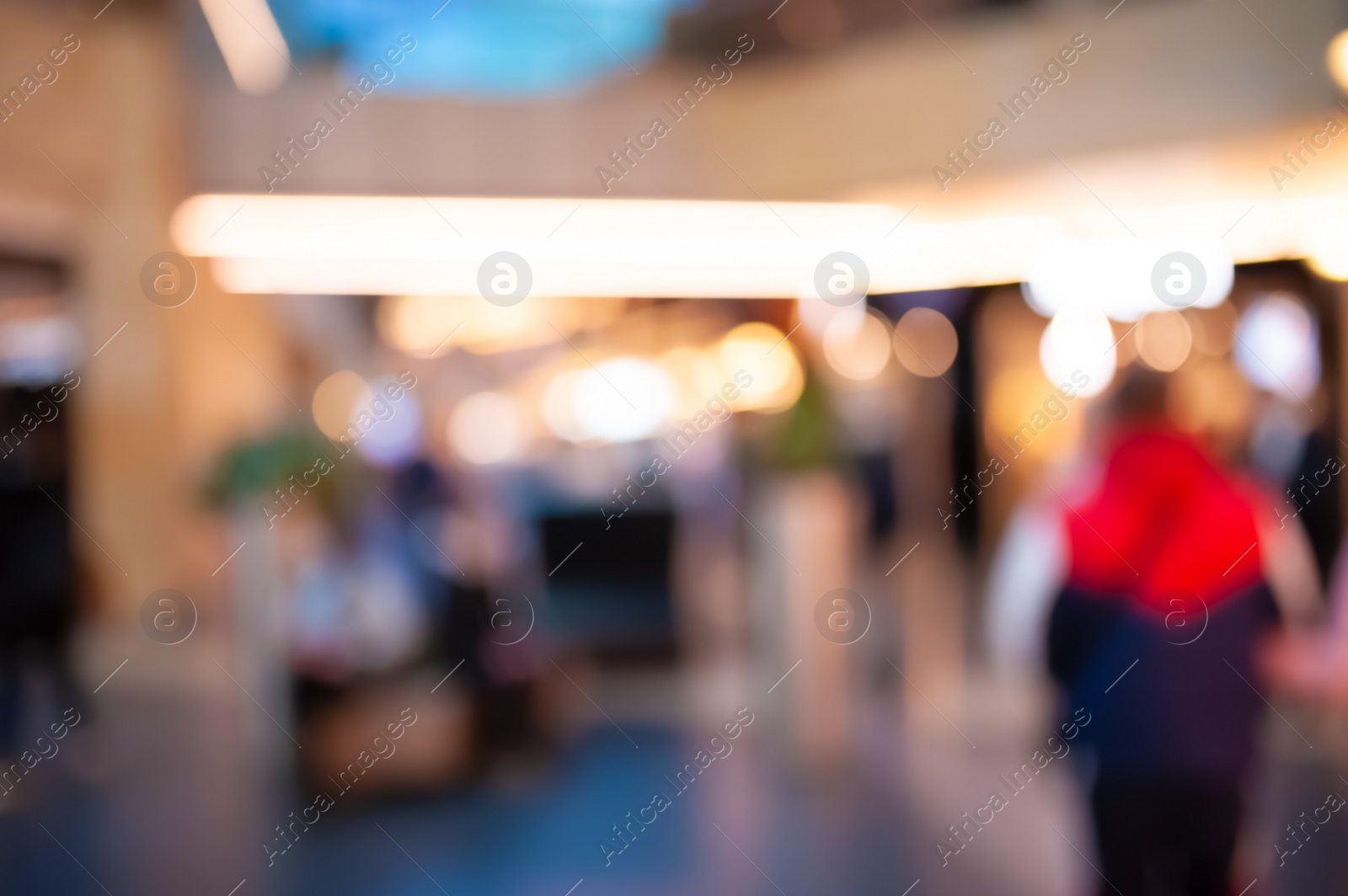 Photo of Blurred view of modern shopping mall interior