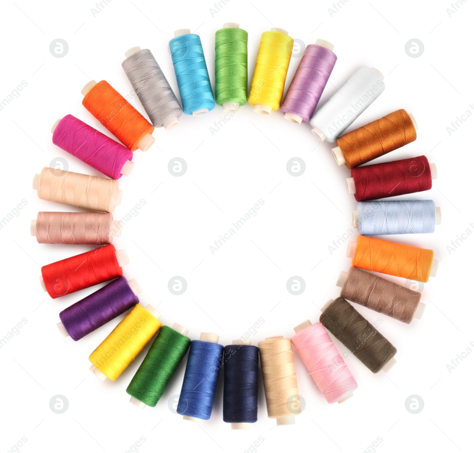 Photo of Frame of colorful sewing threads on white background, top view. Space for text