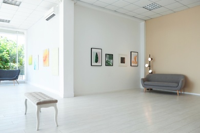 Photo of Empty hall of modern art gallery with exhibits