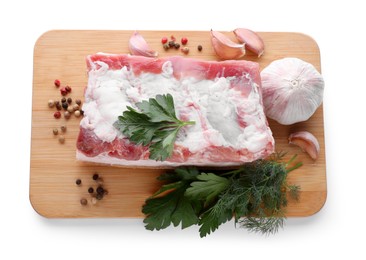 Photo of Piece of pork fatback served with different ingredients isolated on white, top view