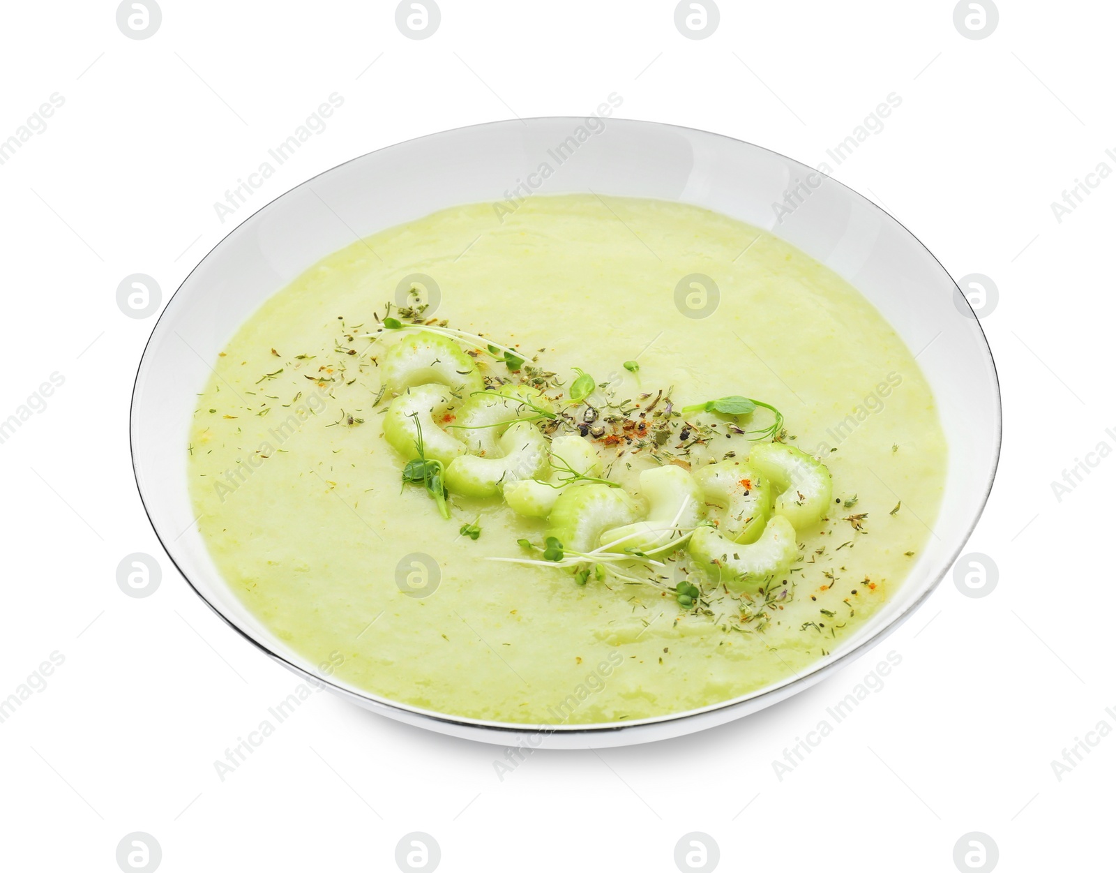 Photo of Bowl of delicious celery soup isolated on white