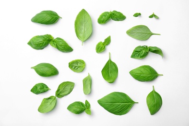 Photo of Fresh green basil leaves on white background, top view