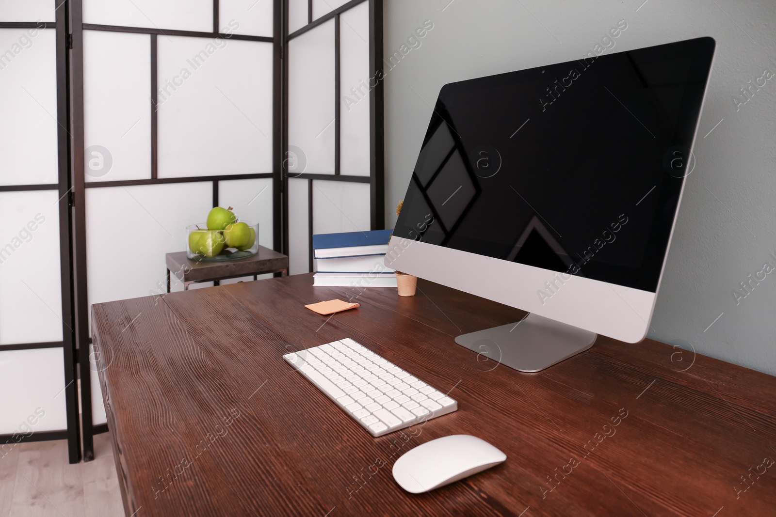 Photo of Comfortable workplace with computer on desk in home office