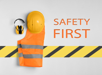 Image of Different safety equipment on light background, flat lay 