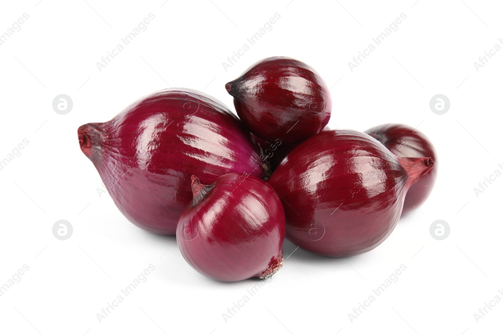 Photo of Fresh whole red onions on white background