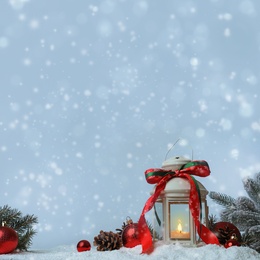 Image of Composition with Christmas lantern on snow, space for text. Bokeh effect